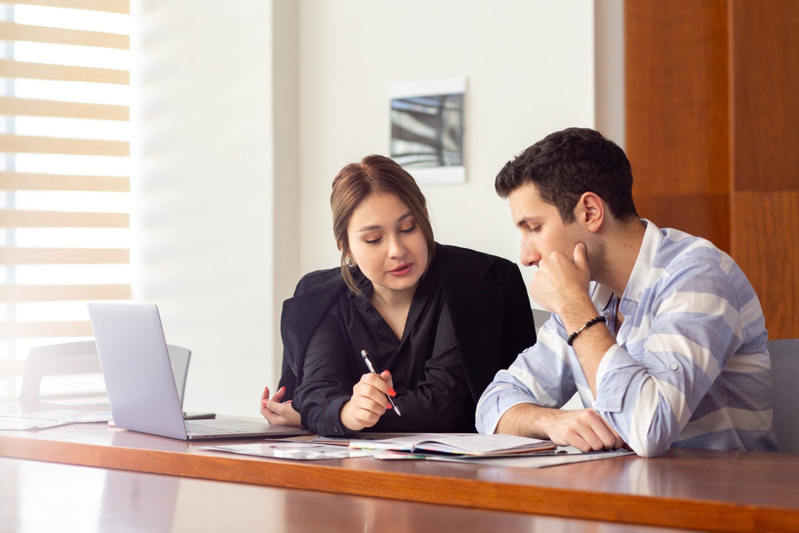 front-view-young-beautiful-businesswoman-black-shirt-black-jacket-along-with-young-man-discussing-work-issues-inside-her-office-work-job-building-scaled