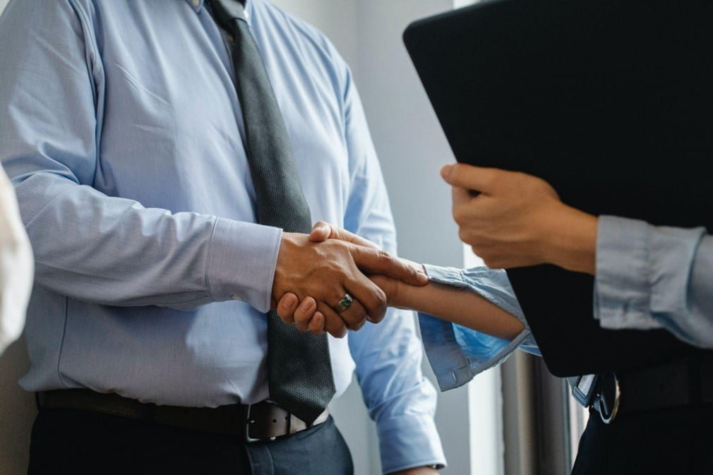 shaking hands_loan shark harassment singapore